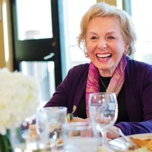 Woman at diner table smiling