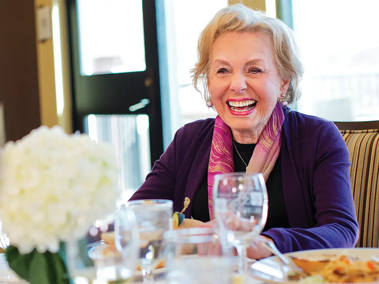 Woman at diner table smiling