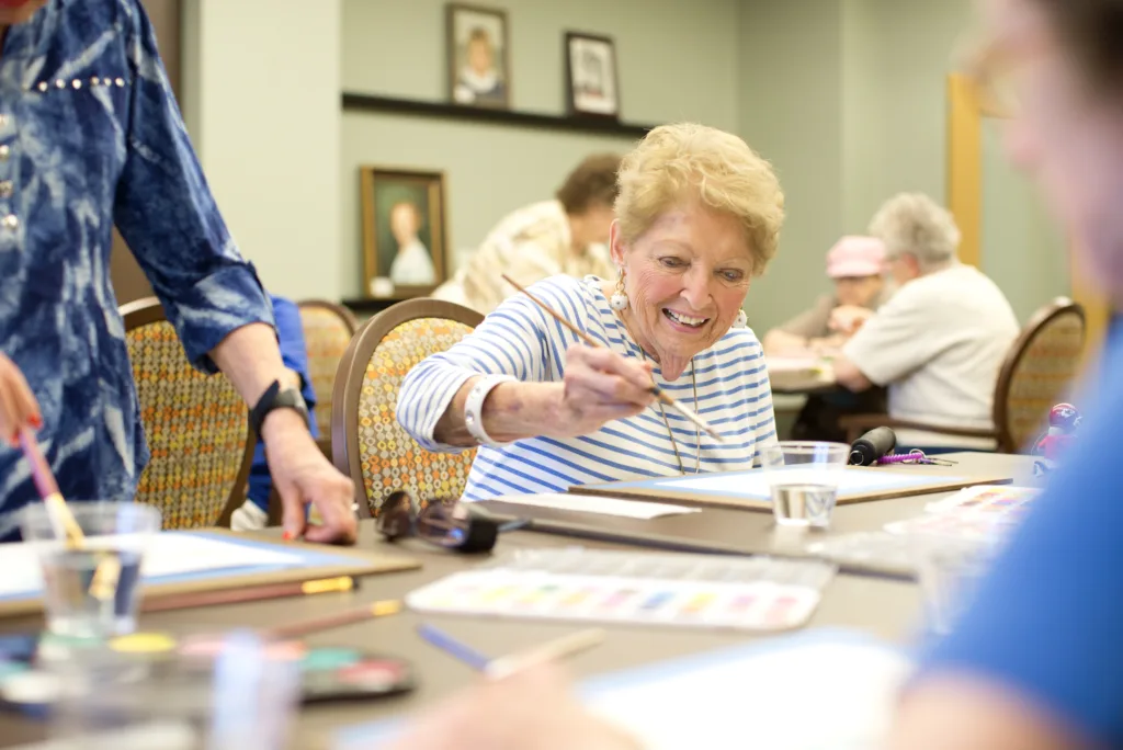Senior woman painting a picture